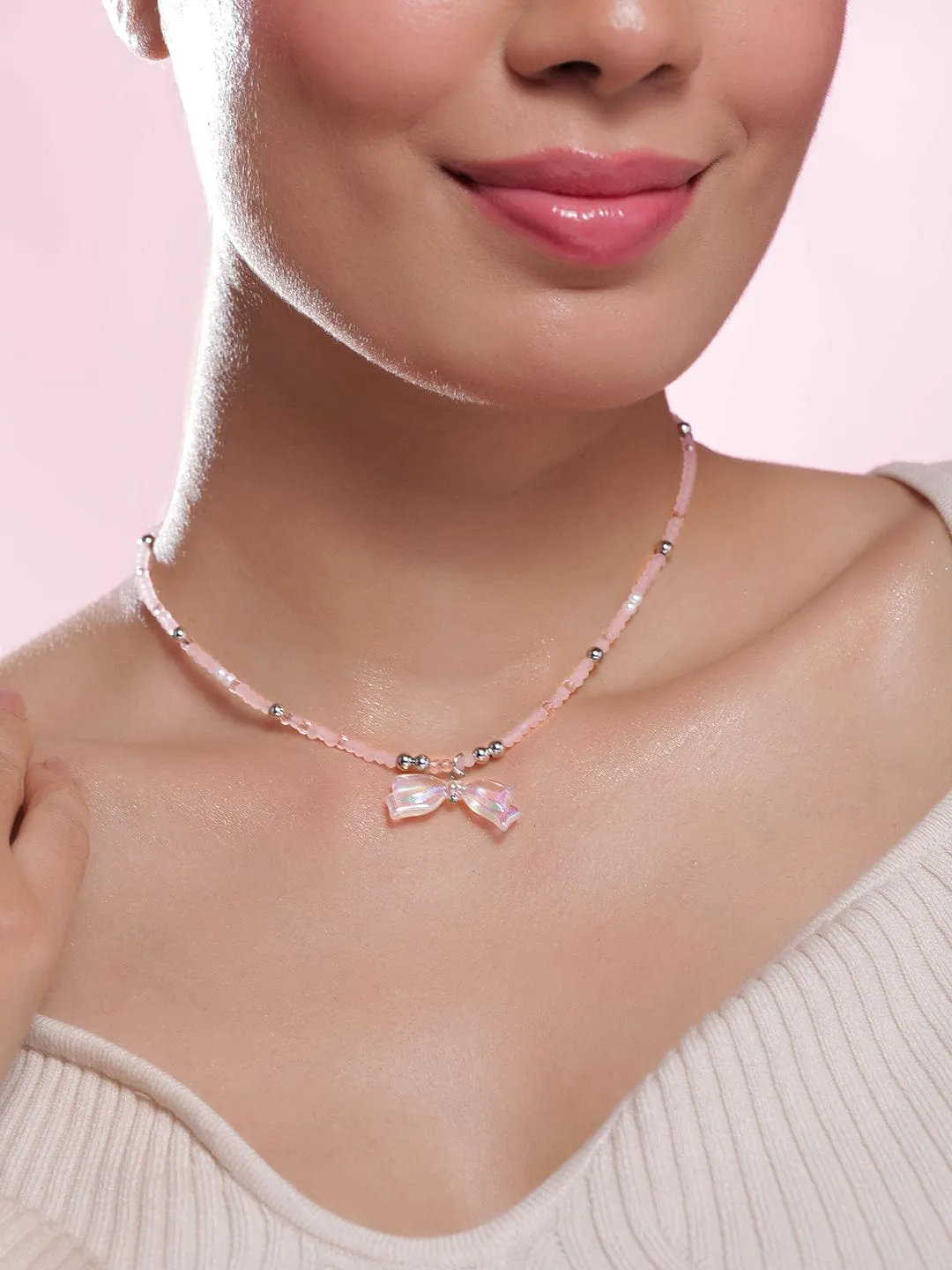 Rhodium Plated Pink Beaded Necklace with Iridescent Butterfly Bow Pendant